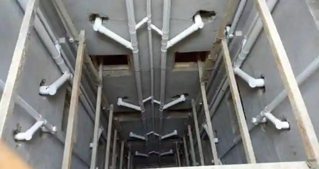 Plumbing risers installed in a vertical service shaft